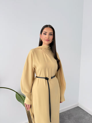 YELLOW MAXI DRESS WITH SHAWL DETAIL AT THE NECK AND BELTED WAIST.